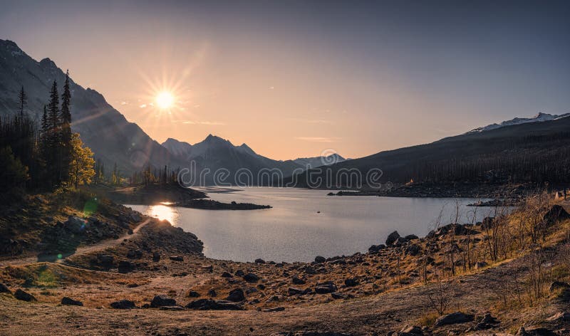 Sunrise on Medecine Lake with mountain range at Jasper national park