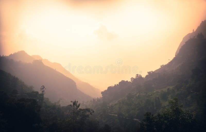 Sunrise mountains landscape with fog in the early morning in Sri Lanka nearby Ella mountain rock royalty free stock photo Sunrise mountains landscape with fog in the early morning in Sri Lanka nearby Ella mountain rock royalty free stock photo