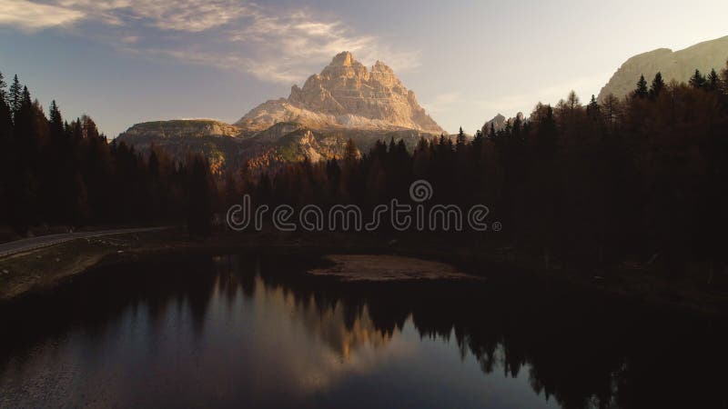 Sunrise over Alpine mountain peaks, forest and Braies Lake. Dolomiti Alps, South Tyrol