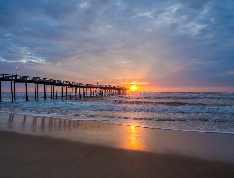 Sunrise over fishing pier at North Carolina Outer Banks stock images Sunrise over fishing pier at North Carolina Outer Banks stock images