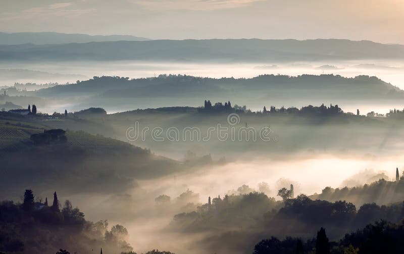 Sunrise over grenn hills of Italy. Misty morning over rural landscape with gardens, farms, fields in Tuscany province royalty free stock photos Sunrise over grenn hills of Italy. Misty morning over rural landscape with gardens, farms, fields in Tuscany province royalty free stock photos