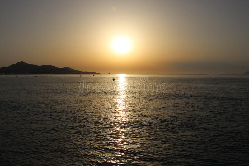 Sunrise Over Majorca with an Trace of Cloud Over the Sun Stock Photo