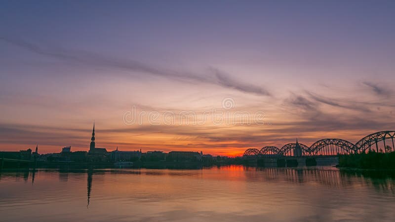 Sunrise over old Riga reflected in the mirror of the Daugava stock images