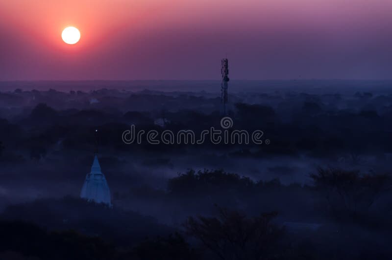 Sunrise over temples of misty and foggy Bagan in stock photography Sunrise over temples of misty and foggy Bagan in stock photography