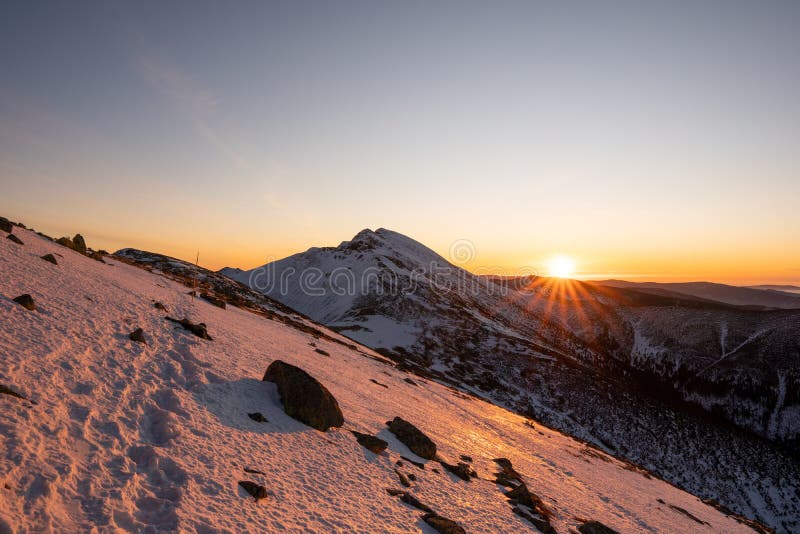 Sunrise on ridge in snowy mountains, Slovakia Low Tatras, dumbier