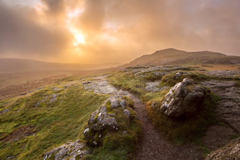 Stormy sunrise on saddle tor dartmoor national park devon uk