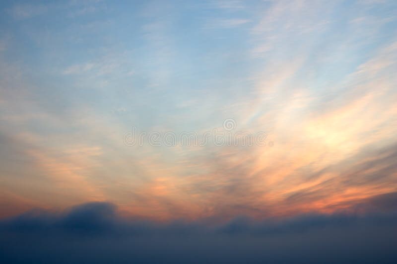 Sunrise scarlet sky with clouds.