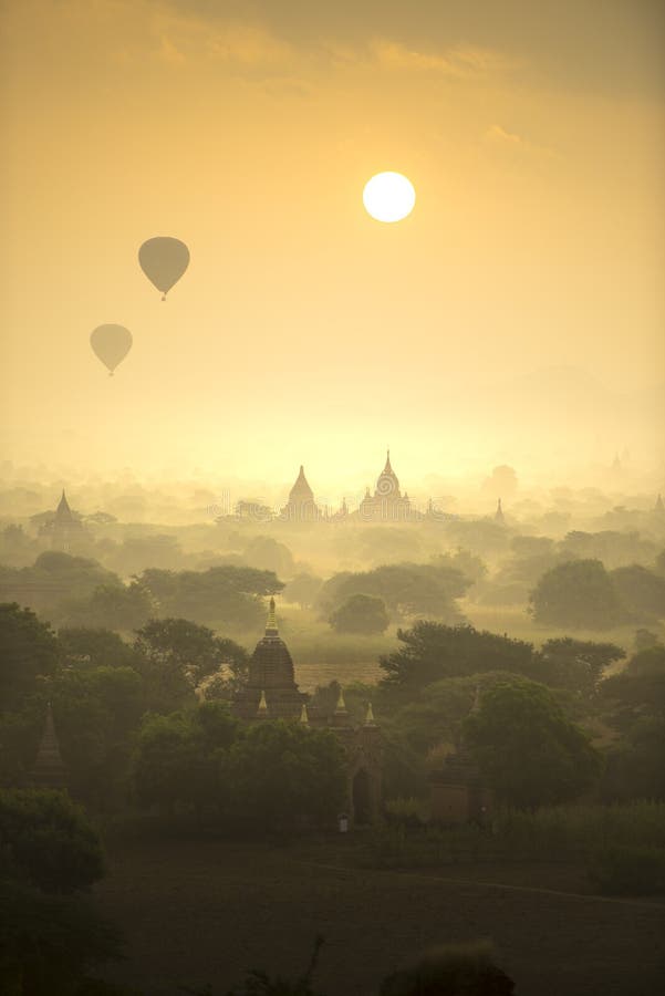 Sunrise scene hot air balloons fly over pagoda ancient city field in Bagan Myanmar.High image quality royalty free stock photo Sunrise scene hot air balloons fly over pagoda ancient city field in Bagan Myanmar.High image quality royalty free stock photo