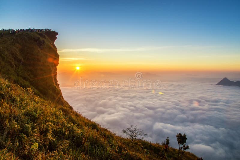 Sunrise scene with the peak of mountain and cloudscape at Phu ch