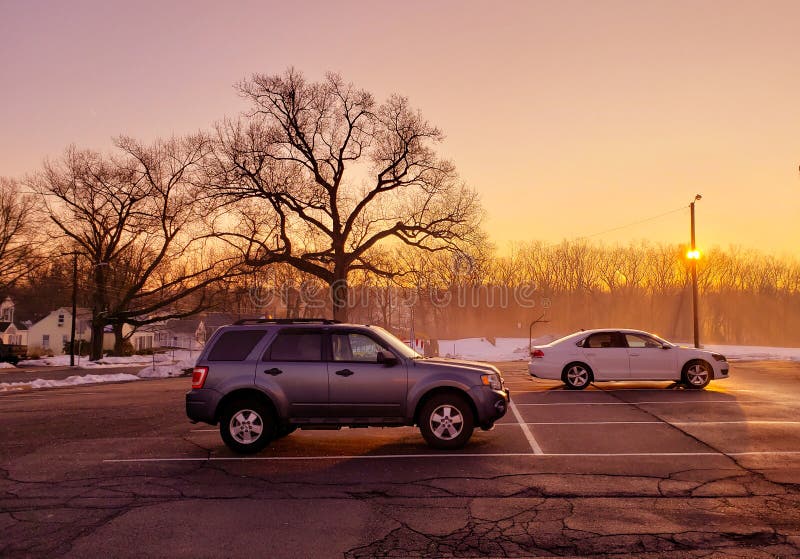 Sunrise sunset in parking lot during winter