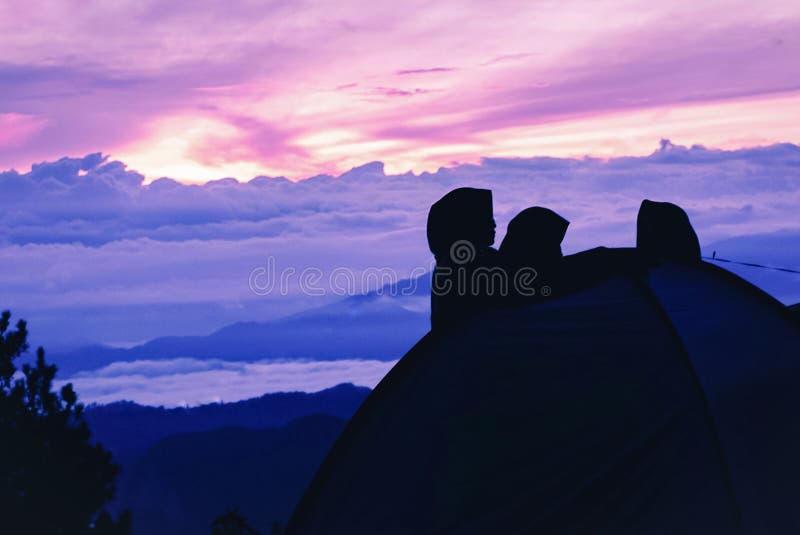Sunrise and tri people stock photo. Image of tend, holiday 242633082