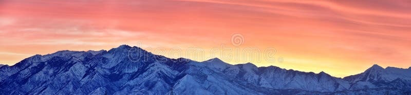 Sunrise of Winter panoramic, view of Snow capped Wasatch Front Rocky Mountains, Great Salt Lake Valley and Cloudscape from the Mou