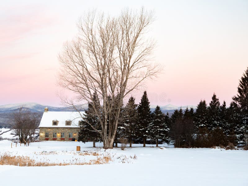 Sunrise Winter View of Steep Roofed Patrimonial Fieldstone House Stock Sunrise Winter View of Steep Roofed Patrimonial Fieldstone House Stock