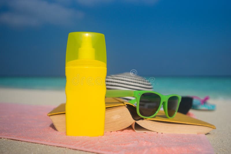 Sunscreen, Hat and Sunglasses on Tropical Beach Stock Photo - Image of ...