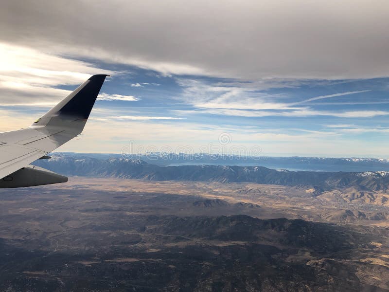 Sunset and airplane wing over Lake Tahoe and Reno. Aerial view of Lake Tahoe and Washoe Lake outside of Reno, Nevada stock images Sunset and airplane wing over Lake Tahoe and Reno. Aerial view of Lake Tahoe and Washoe Lake outside of Reno, Nevada stock images