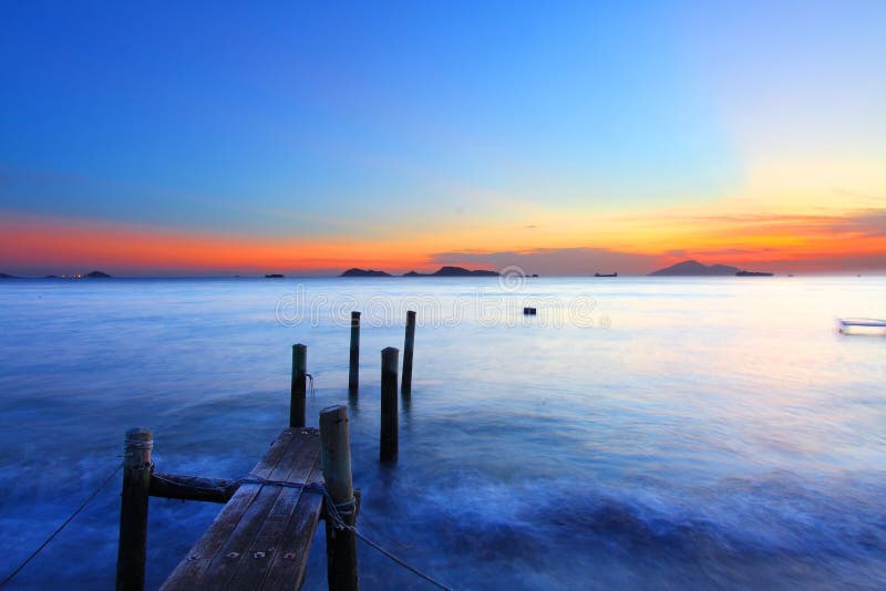 Sunset along a wooden pier