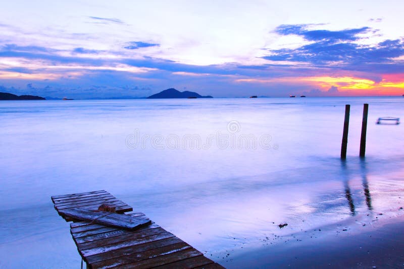 Sunset along a wooden pier