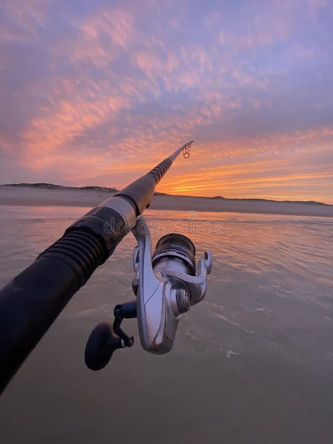 https://thumbs.dreamstime.com/b/sunset-beach-fishing-pole-reel-saltwater-rod-front-colorful-new-jersey-summertime-activities-atlantic-ocean-278005925.jpg