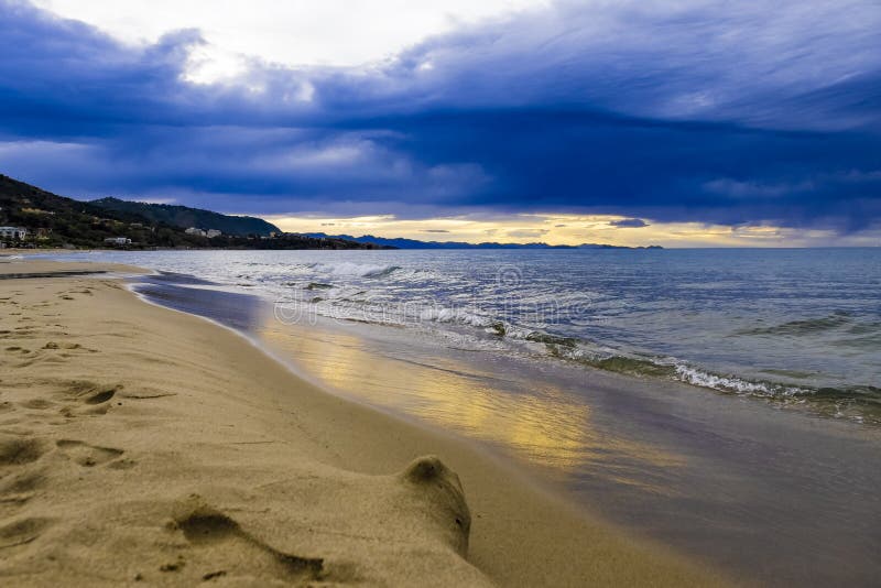 Sunset on beach on Tyrrhenian Sea, Mediterranean Sea - Cefalu, Sicily, Italy stock photography Sunset on beach on Tyrrhenian Sea, Mediterranean Sea - Cefalu, Sicily, Italy stock photography