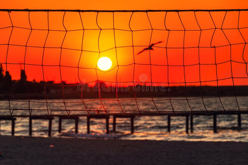 Sunset at the beach with the volleyball net stock photography Sunset at the beach with the volleyball net stock photography