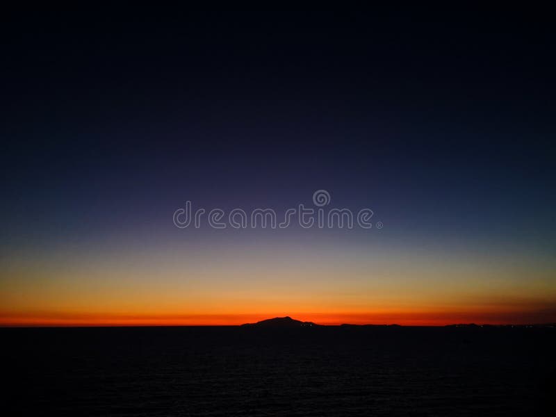 Sunset behind Ischia Island, seen from Massa Lubrense, taken in low light