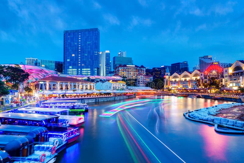 Sunset Blue Hour at Clarke Quay on Singapore River With Boat Light Trails