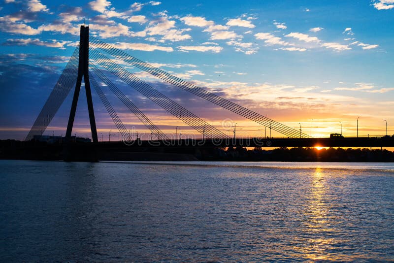 Sunset bridge river Daugava Riga