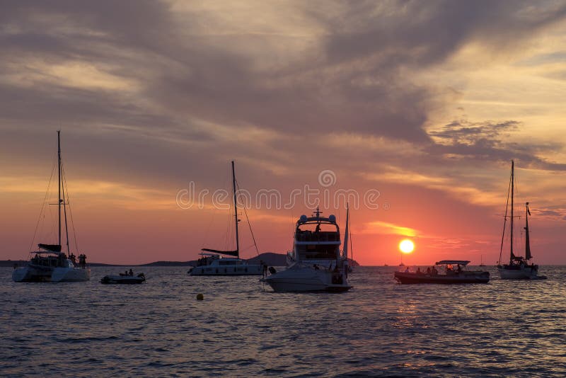 Boats in the sea in front of CafÃ© del Mar at the Spanish Island Ibiza in the mediterranean sea in Europe. CafÃ© del Mar is a famous spot on the island and the best place for sunset. Boats in the sea in front of CafÃ© del Mar at the Spanish Island Ibiza in the mediterranean sea in Europe. CafÃ© del Mar is a famous spot on the island and the best place for sunset.