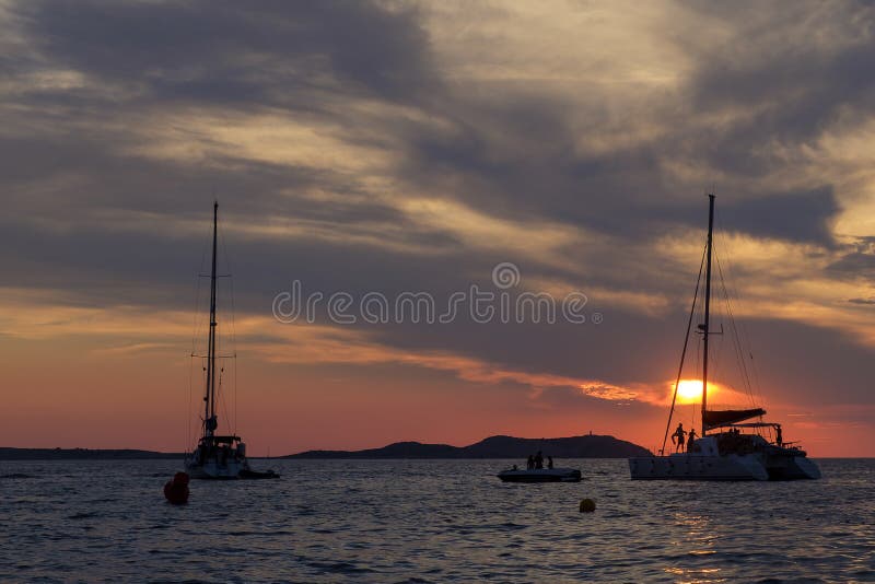 Boats in the sea in front of CafÃ© del Mar at the Spanish Island Ibiza in the mediterranean sea in Europe. CafÃ© del Mar is a famous spot on the island and the best place for sunset. Boats in the sea in front of CafÃ© del Mar at the Spanish Island Ibiza in the mediterranean sea in Europe. CafÃ© del Mar is a famous spot on the island and the best place for sunset.