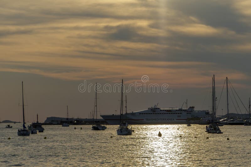 Boats in the sea in front of CafÃ© del Mar at the Spanish Island Ibiza in the mediterranean sea in Europe. CafÃ© del Mar is a famous spot on the island and the best place for sunset. Boats in the sea in front of CafÃ© del Mar at the Spanish Island Ibiza in the mediterranean sea in Europe. CafÃ© del Mar is a famous spot on the island and the best place for sunset.