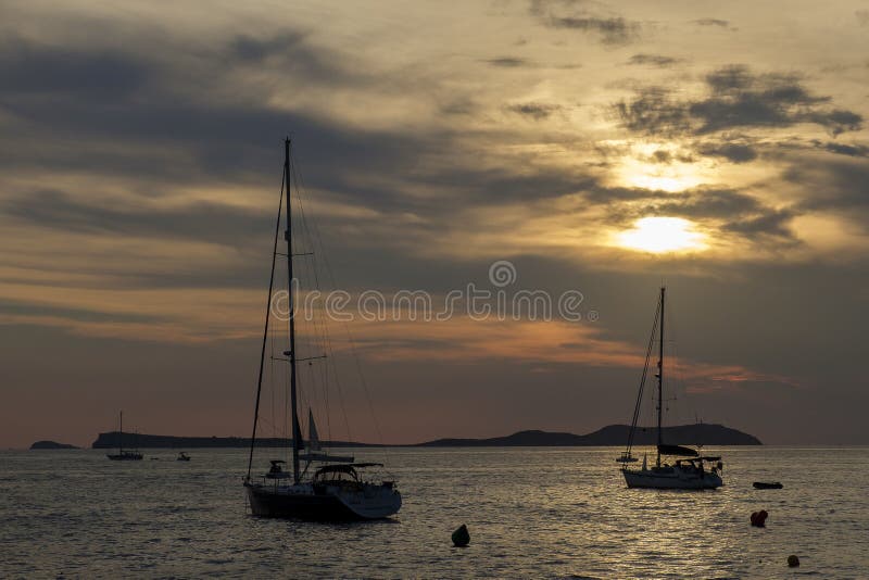 Boats in the sea in front of CafÃ© del Mar at the Spanish Island Ibiza in the mediterranean sea in Europe. CafÃ© del Mar is a famous spot on the island and the best place for sunset. Boats in the sea in front of CafÃ© del Mar at the Spanish Island Ibiza in the mediterranean sea in Europe. CafÃ© del Mar is a famous spot on the island and the best place for sunset.