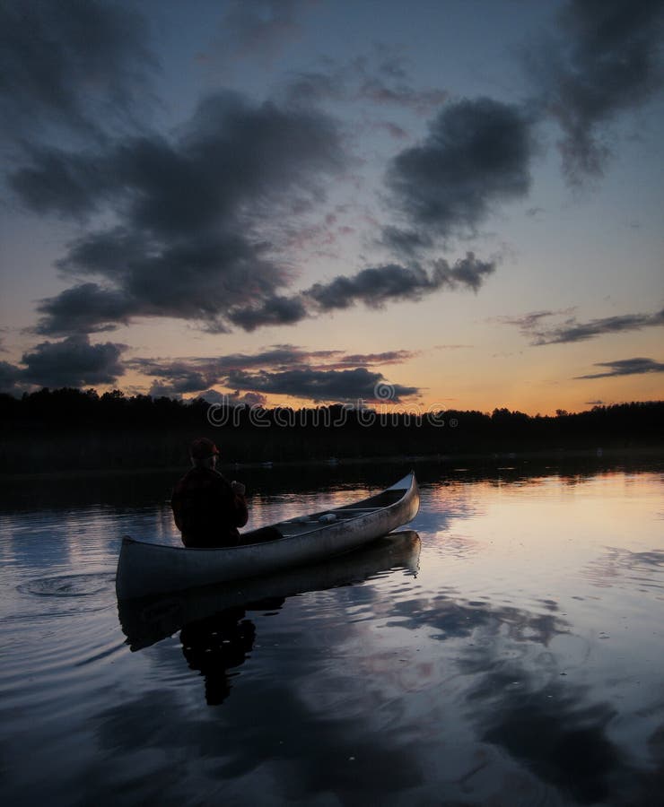 Sunset Canoe stock photo. Image of lake, paddles, human 57115286