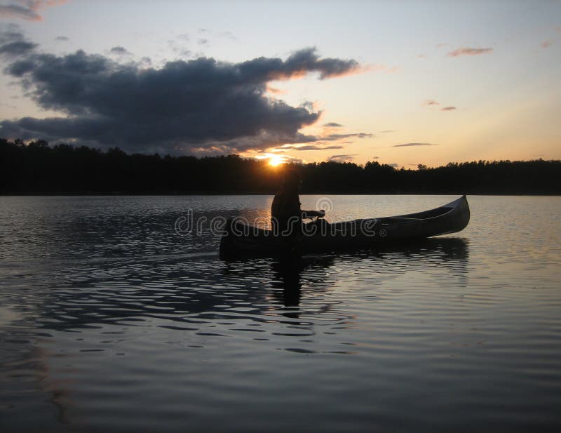 Sunset Canoe stock image. Image of canoe, paddle, water 57115125