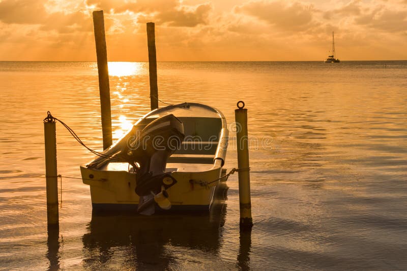 Sunset in the Caribbean sea by Caye Caulker island, Belize royalty free stock photography Sunset in the Caribbean sea by Caye Caulker island, Belize royalty free stock photography