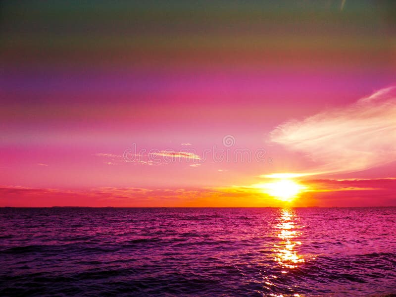 Sunset and cloud on horizon and dark purple water royalty free stock image Sunset and cloud on horizon and dark purple water royalty free stock image