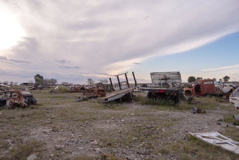 Sunset in old car depot stock image Sunset in old car depot stock image