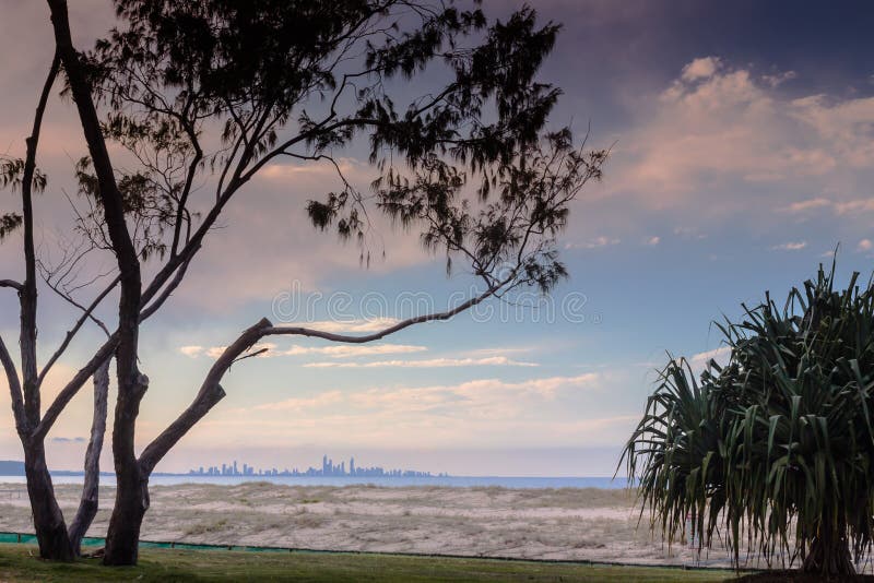 Sunset In Coolangatta. You can see the Gold Coast skyline bathing in the sunset from the beach in Coolangatta, Queensland, Australia royalty free stock photo Sunset In Coolangatta. You can see the Gold Coast skyline bathing in the sunset from the beach in Coolangatta, Queensland, Australia royalty free stock photo