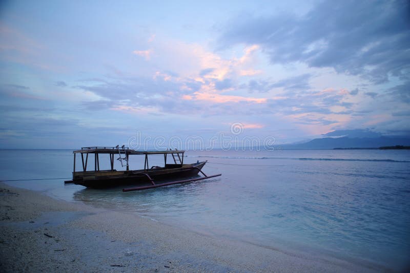 Sunset and fisherman boat in Gili Islands