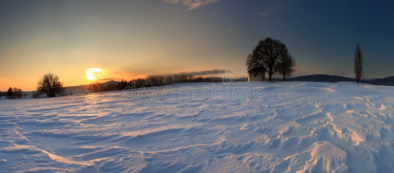 Sunset on frozen field.