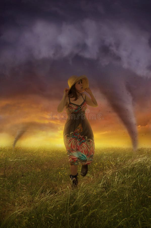 At sunset, the girl runs away from a tornado