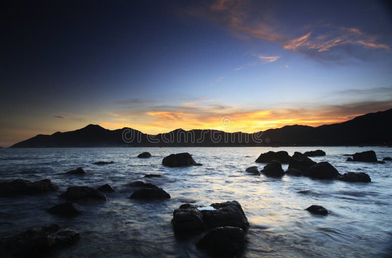 Sunset glow at the seasdie stock photo. Image of sunset 26008284