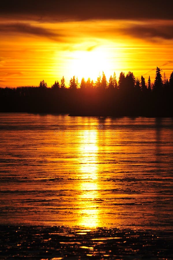 Sunset on ice lake royalty free stock images