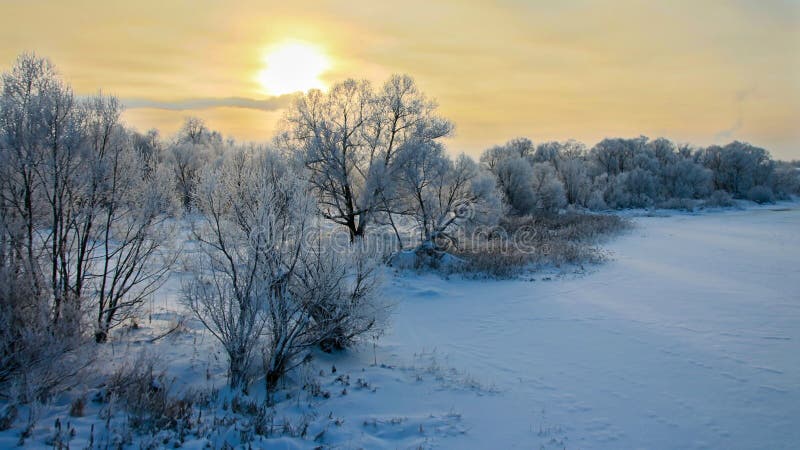 Sunset in January Over the River Stock Image - Image of outdoor, snow ...