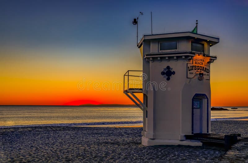 Sunset in Laguna Beach, famous tourist destination in California, USA with a lifeguard station in the foreground