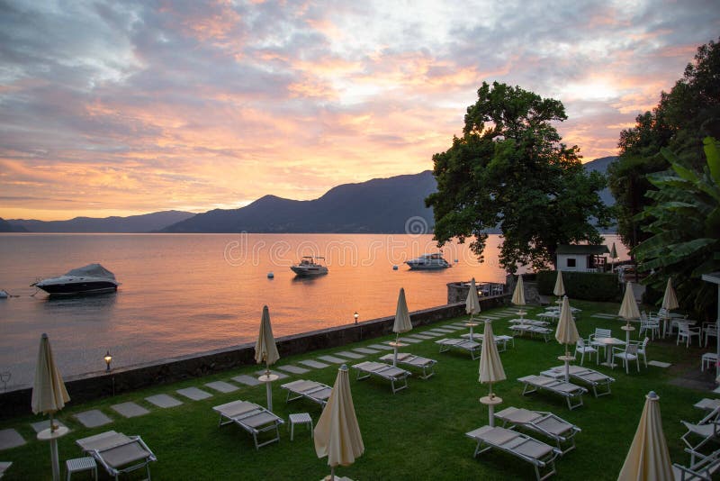 Sunset lake - lago - Maggiore, Italy. luxury hotel beach