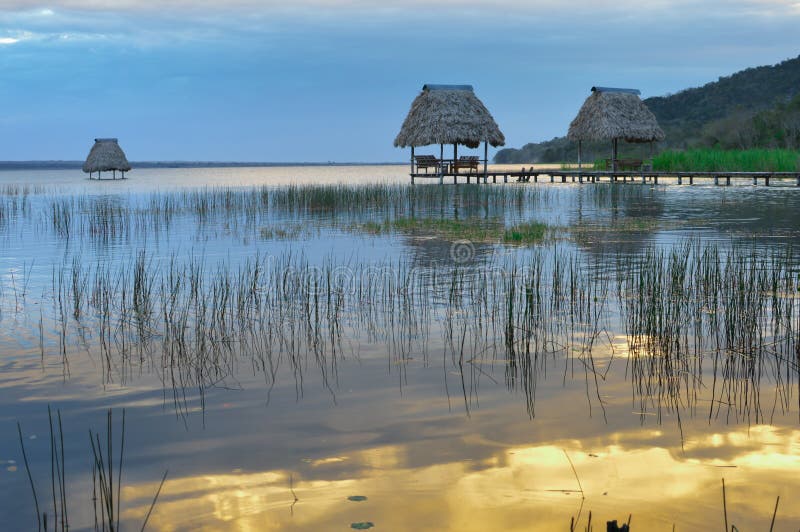 Early minutes of sunset at the lake Peten Itza by the little village of El Ramate, Guatemala. Early minutes of sunset at the lake Peten Itza by the little village of El Ramate, Guatemala