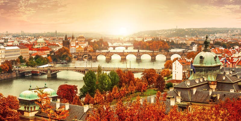 Sunset landscape view to Charles bridge on Vltava river in Prague