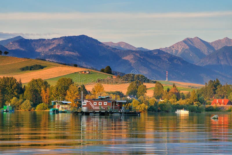 Sunset on Liptovska Mara dam with West Tatras on horizont