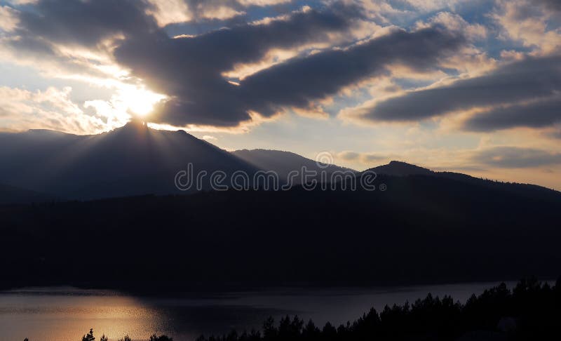 Sunset with mountain and lake