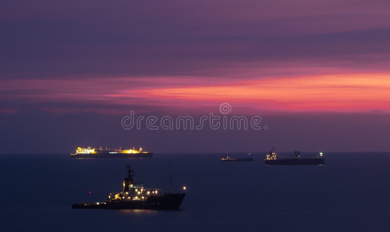 Sunset over anchored container ships in Kaohsiung